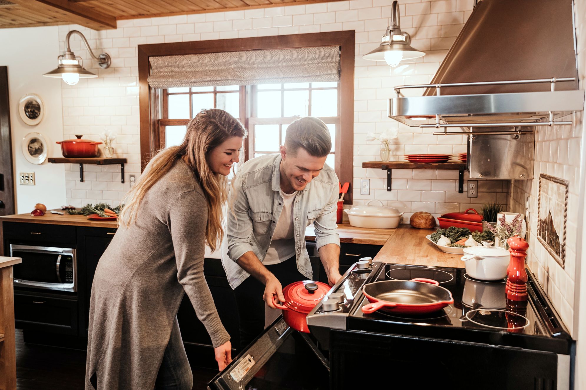 Couple baking in kitchen; bamboo countertops and bamboo butcher blocks
