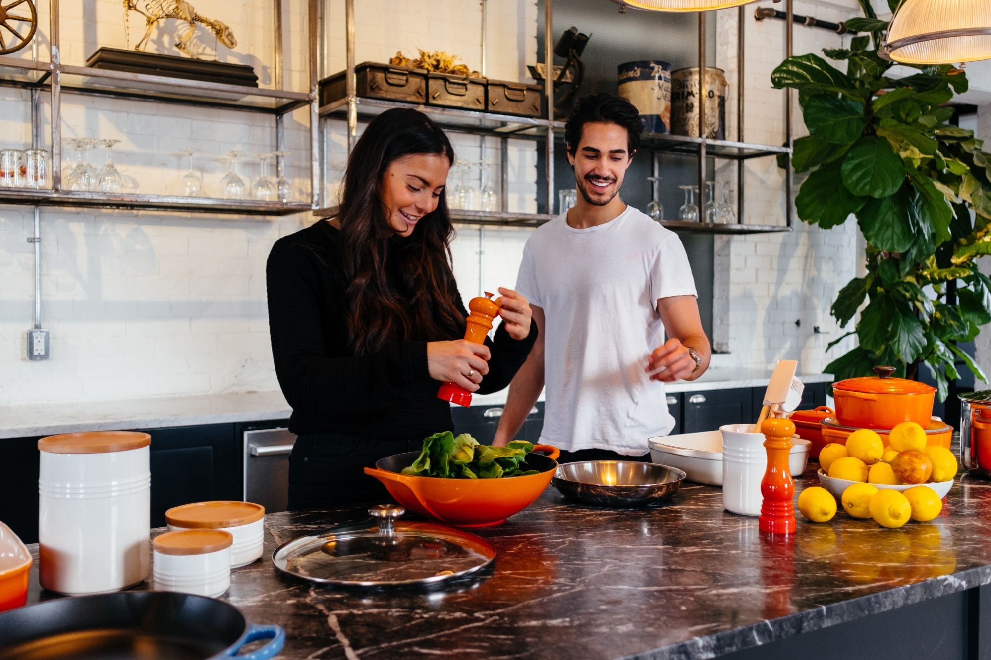 Couple cooking; bamboo bowls