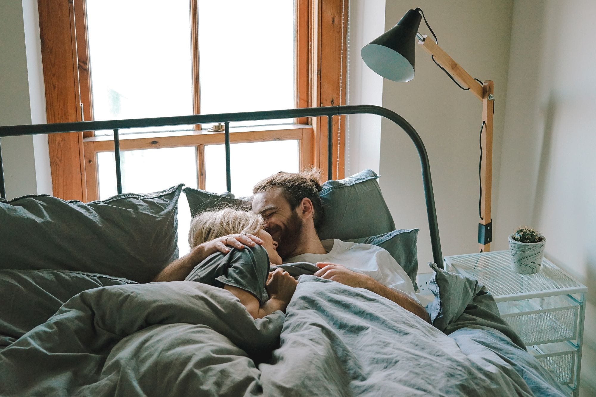 Couple in bed; bamboo sheets