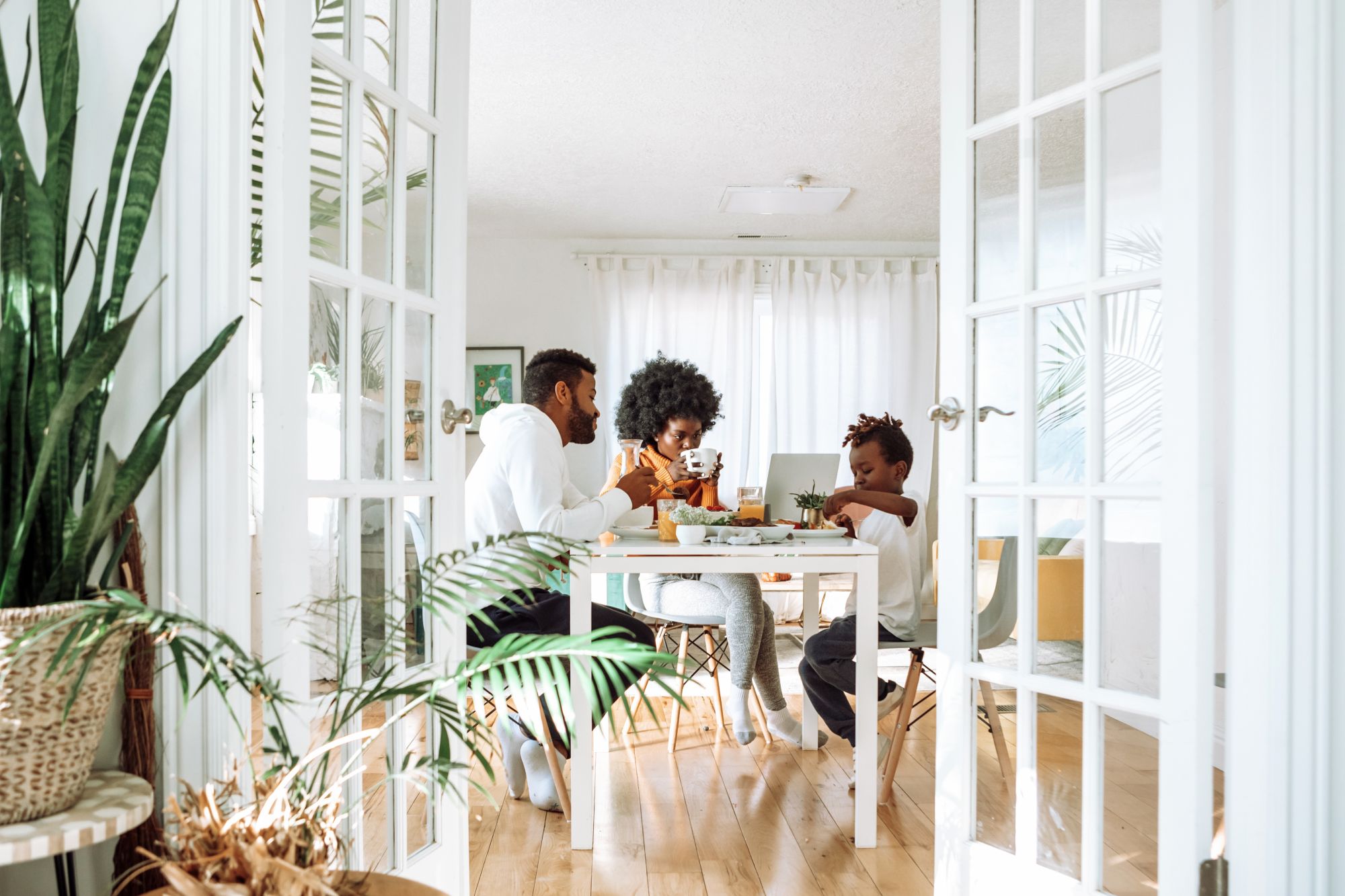 Family eating breakfast; bamboo rugs