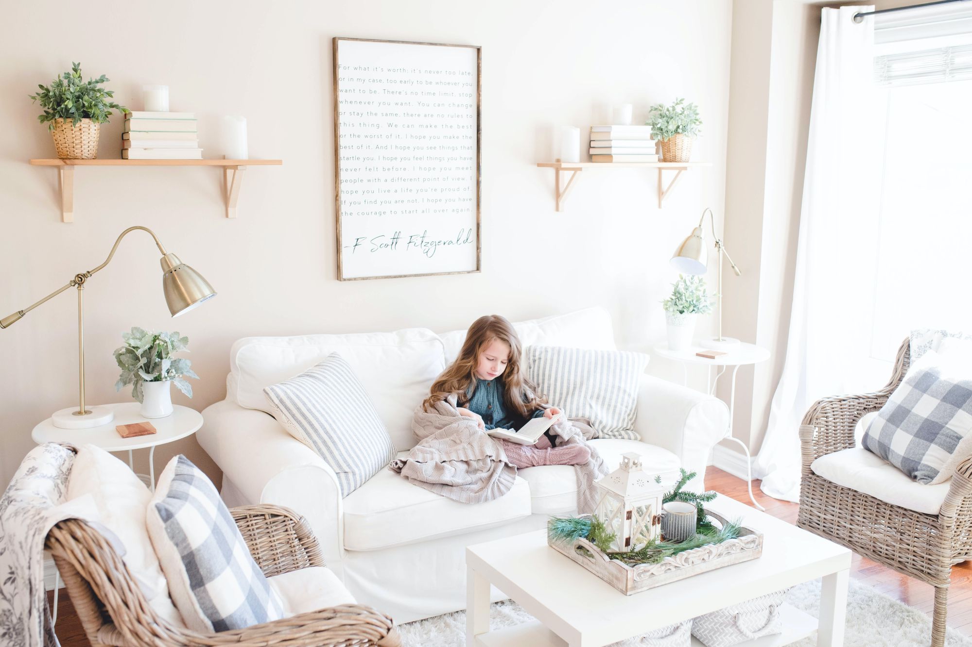 Girl reading on couch; bamboo curtains