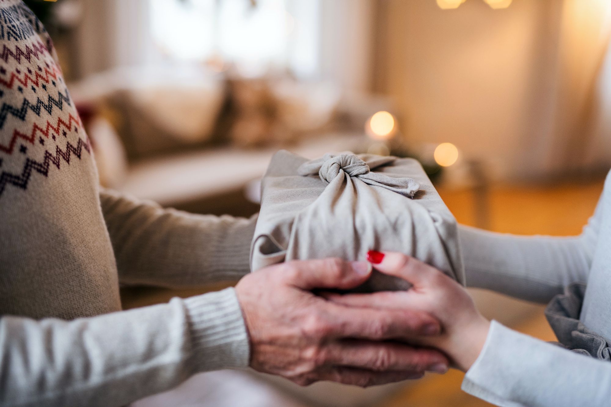 Giving a give wrapped in a bamboo sheet; bamboo gifts